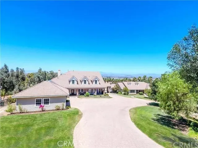 a view of a house with a yard porch and sitting area