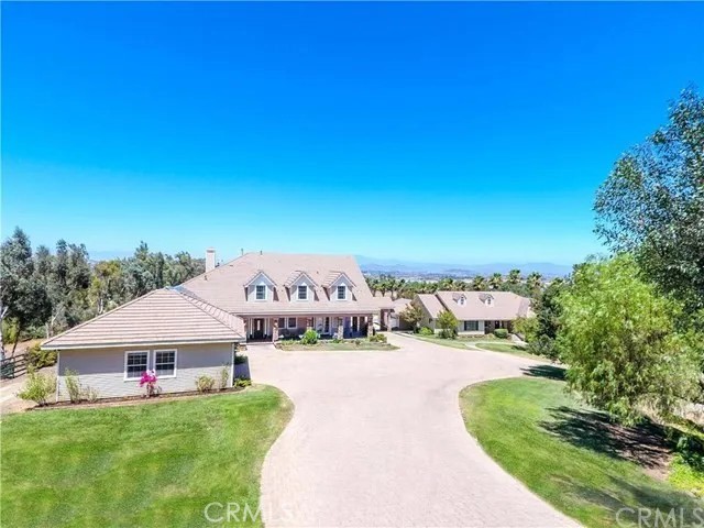 a view of a house with a yard porch and sitting area