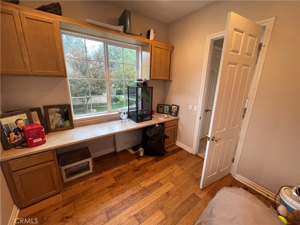 25452 Edna Road Murrieta, CA 92562 - Photo 12 of 70 a room with wooden floor and furniture