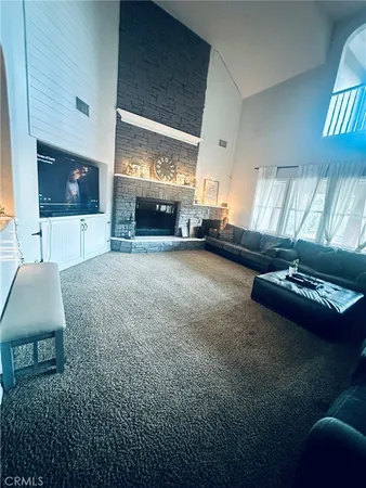 a view of a dining room with furniture wooden floor and chandelier