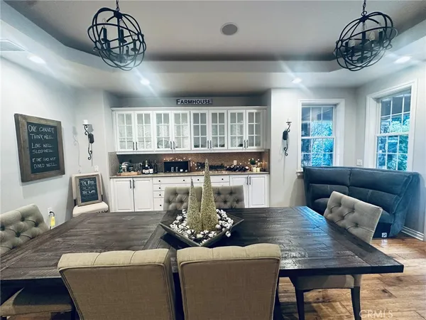 a living room with furniture and large windows