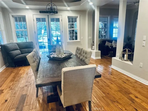 a room with wooden floor and furniture