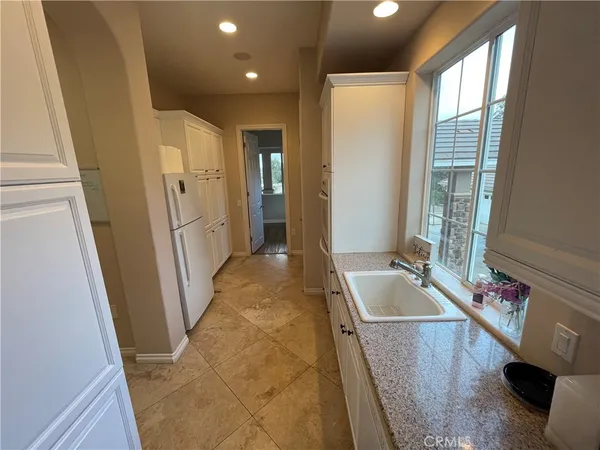 a view of a hallway with seating area