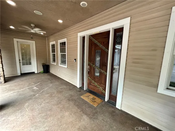 a view of a chairs and table in a patio