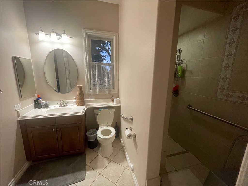 25452 Edna Road Murrieta, CA 92562 - Photo 30 of 70 a bathroom with a sink and a mirror