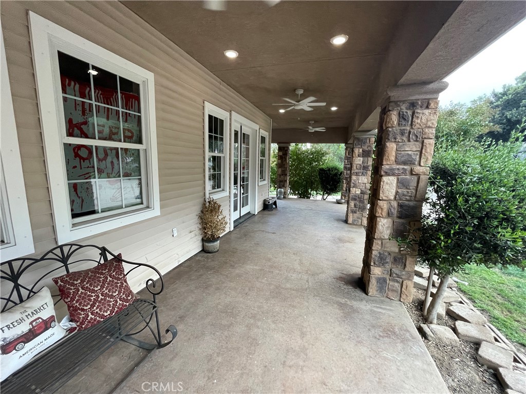 25452 Edna Road Murrieta, CA 92562 - Photo 3 of 70 a view of a chairs and table in a patio