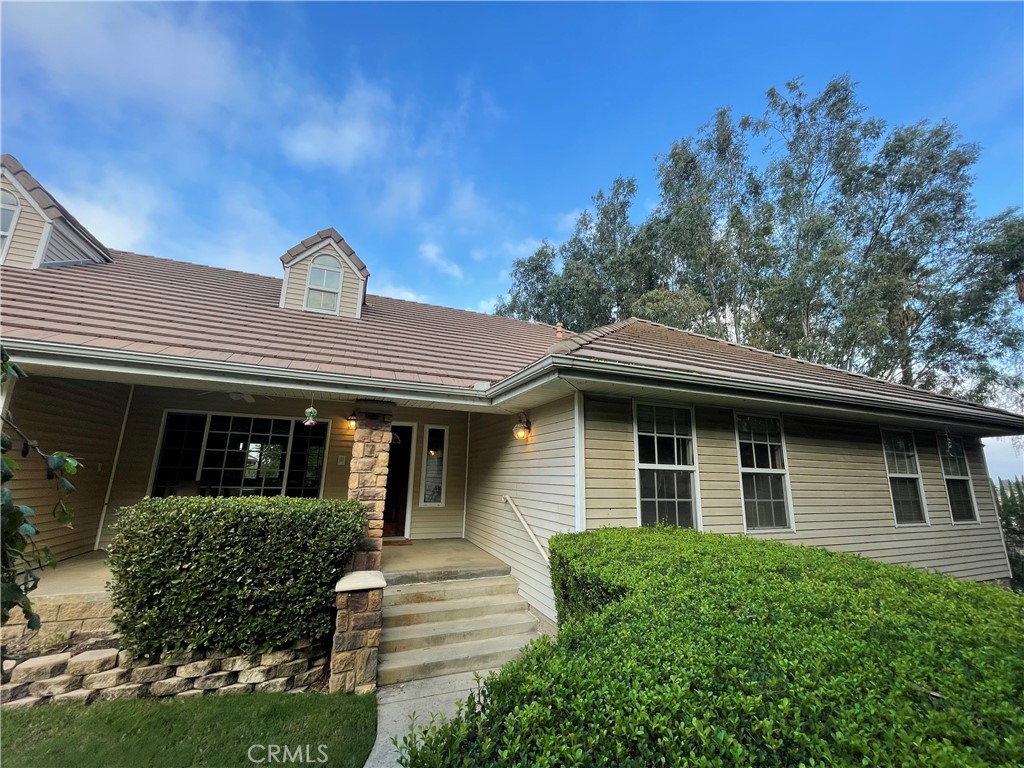 25452 Edna Road Murrieta, CA 92562 - Photo 31 of 70 a front view of a house with a garden