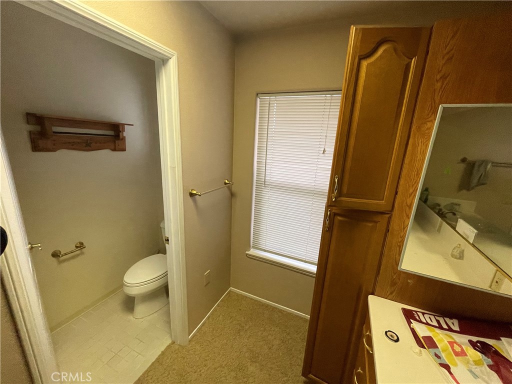 25452 Edna Road Murrieta, CA 92562 - Photo 41 of 70 a bathroom with a granite countertop sink and a mirror