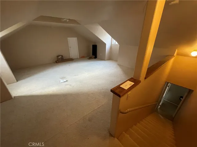 a kitchen with a table chairs and a refrigerator