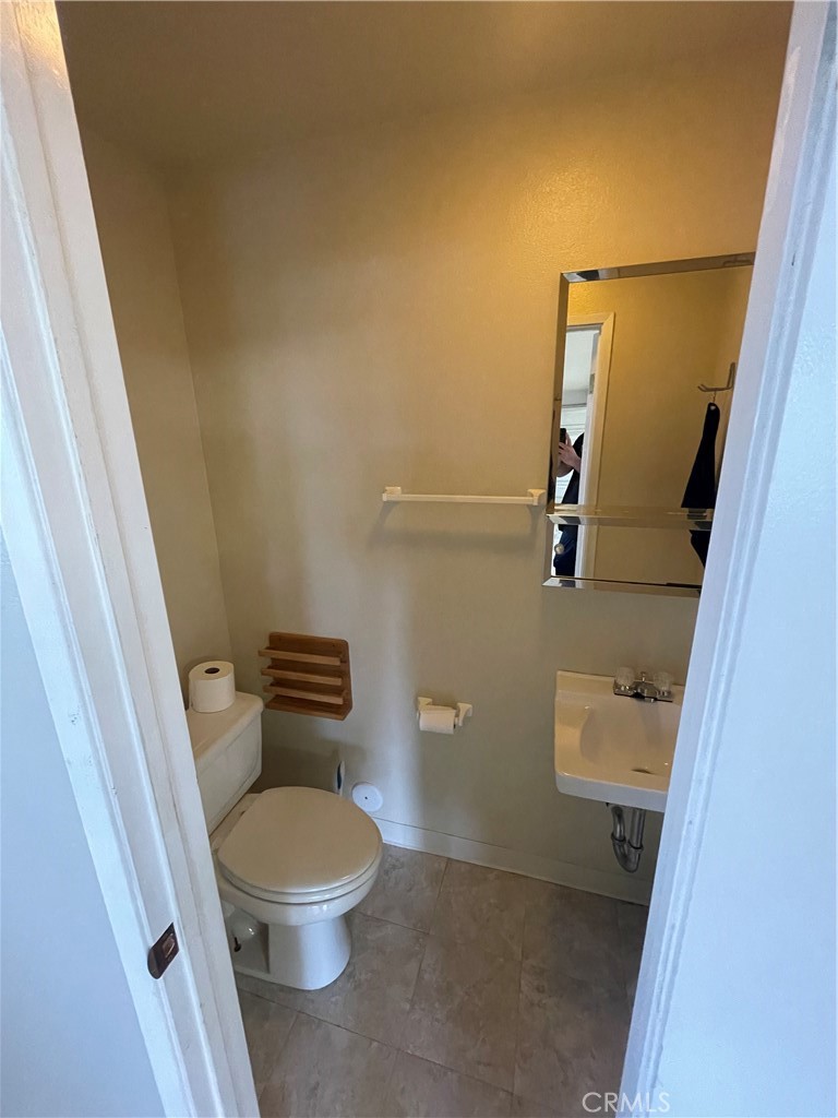 25452 Edna Road Murrieta, CA 92562 - Photo 48 of 70 a white toilet sitting next to a sink