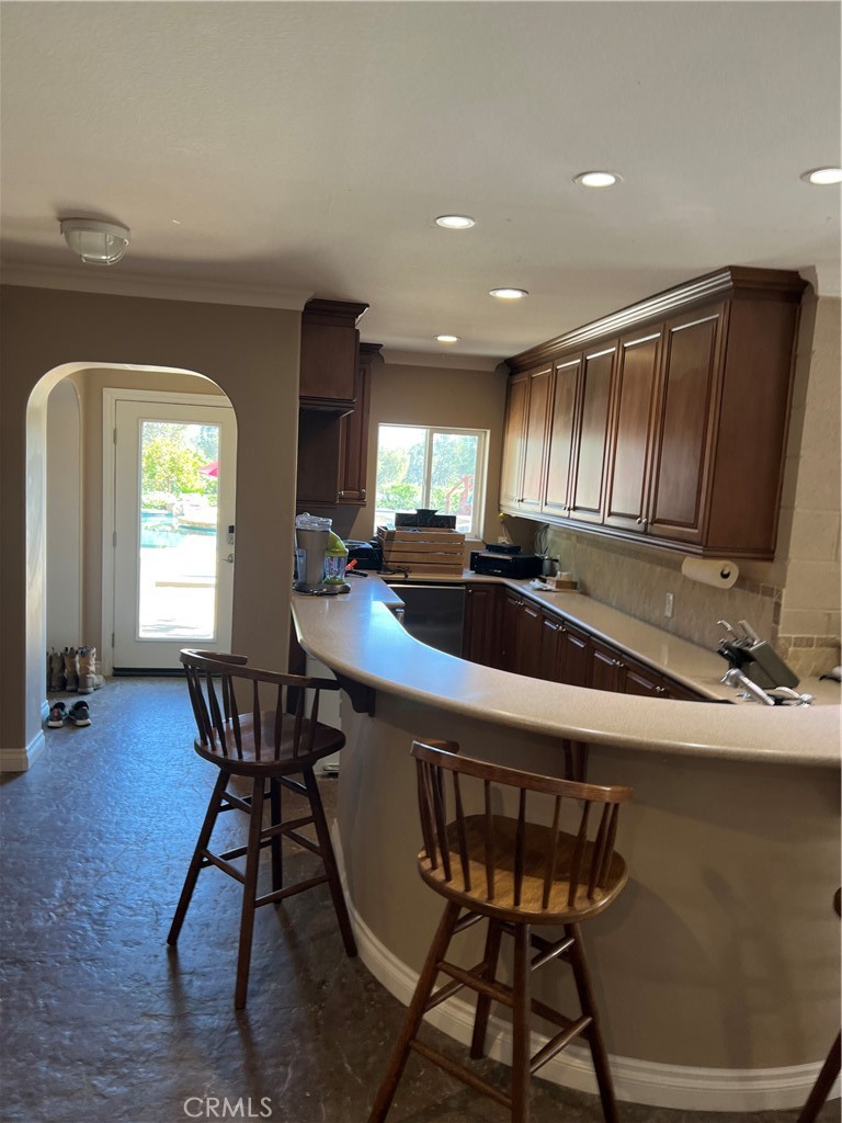 25452 Edna Road Murrieta, CA 92562 - Photo 63 of 70 a kitchen with a table chairs and a refrigerator