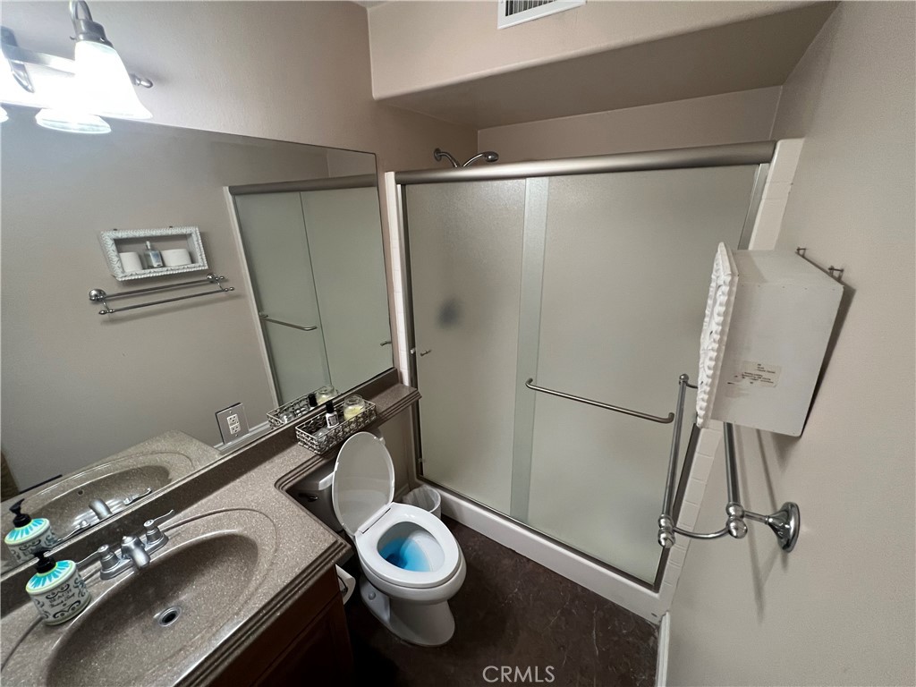 25452 Edna Road Murrieta, CA 92562 - Photo 65 of 70 a bathroom with a sink and a mirror