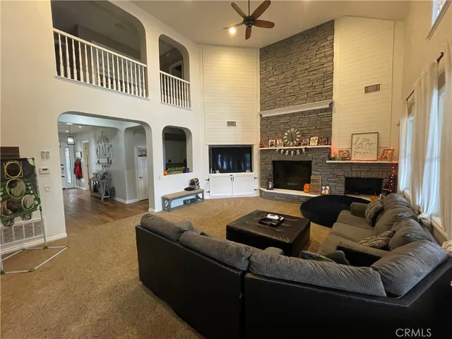 a view of living room with furniture and a couch
