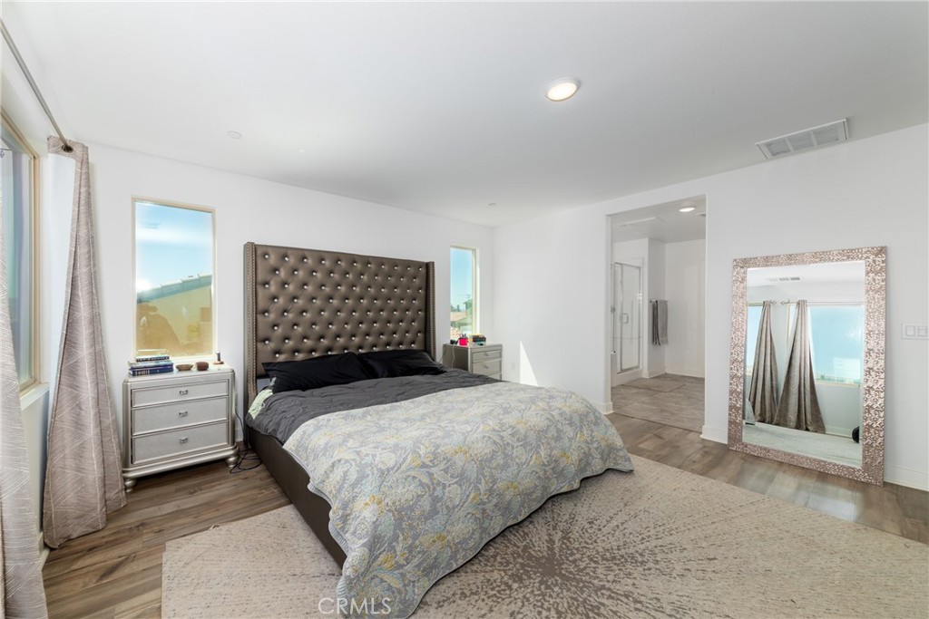 1740 Boysen Way Beaumont, CA 92223 - Photo 30 of 49 a bedroom with a bed and a dresser