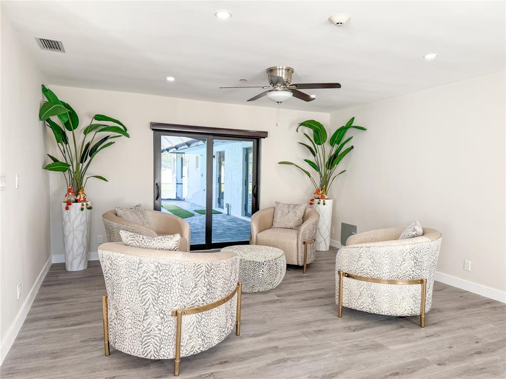 5790 Melaleuca Road Southwest Ranches, FL 33330 - Photo 11 of 44 a living room with furniture potted plant and wooden floor