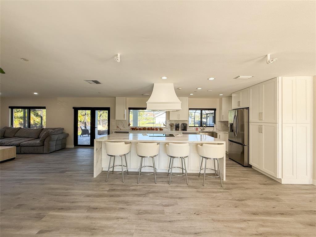 5790 Melaleuca Road Southwest Ranches, FL 33330 - Photo 12 of 44 a view of a dining room with furniture and wooden floor