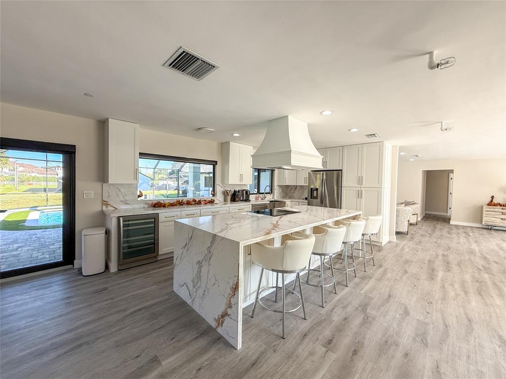 5790 Melaleuca Road Southwest Ranches, FL 33330 - Photo 16 of 44 a view of kitchen with sink and wooden floor