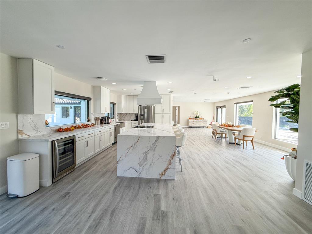 5790 Melaleuca Road Southwest Ranches, FL 33330 - Photo 19 of 44 a large white kitchen with lots of counter top space a sink and appliances