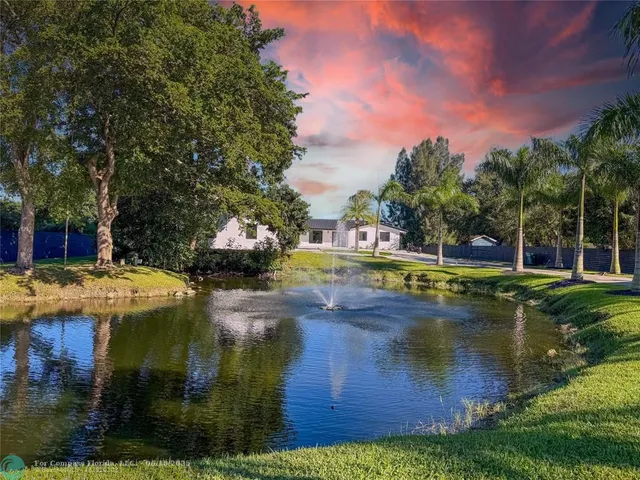 a view of a swimming pool with an outdoor space and seating area