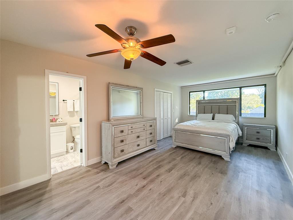 5790 Melaleuca Road Southwest Ranches, FL 33330 - Photo 21 of 44 a bedroom with a bed and a chandelier