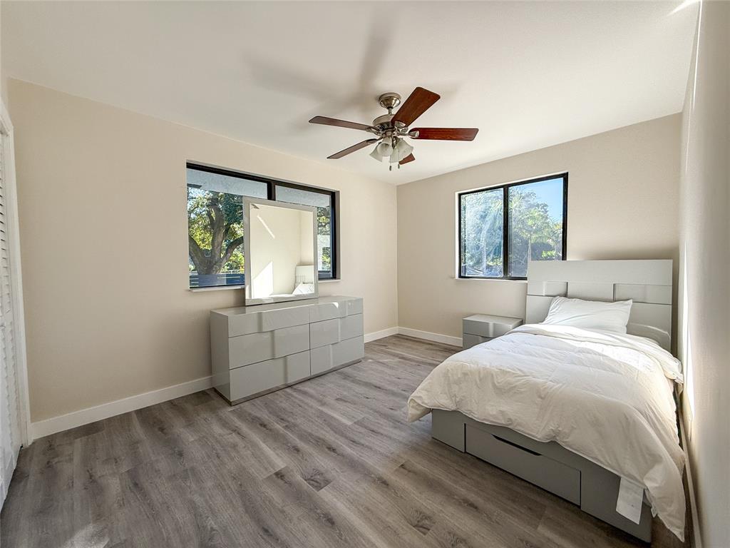 5790 Melaleuca Road Southwest Ranches, FL 33330 - Photo 22 of 44 a bedroom with a bed and a window