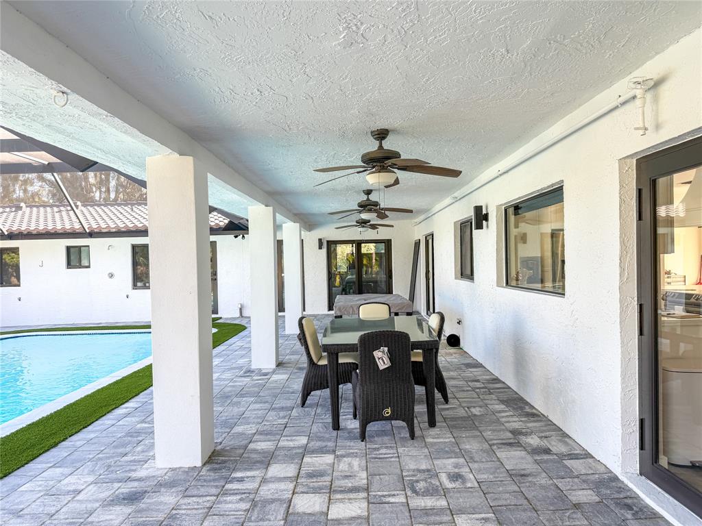 5790 Melaleuca Road Southwest Ranches, FL 33330 - Photo 27 of 44 a view of a dining room with furniture window and outside view