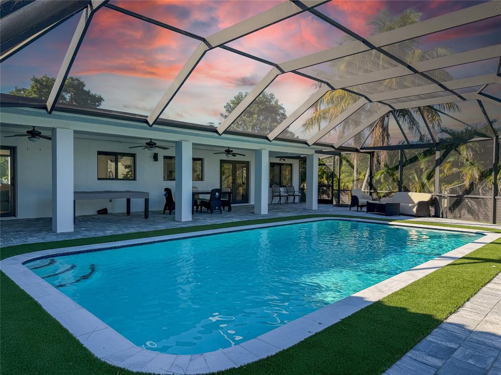 5790 Melaleuca Road Southwest Ranches, FL 33330 - Photo 3 of 44 a view of a backyard with a swimming pool