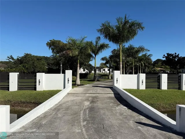 a view of a yard with a patio
