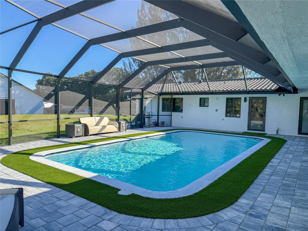 5790 Melaleuca Road Southwest Ranches, FL 33330 - Photo 36 of 44 a view of a backyard with swimming pool