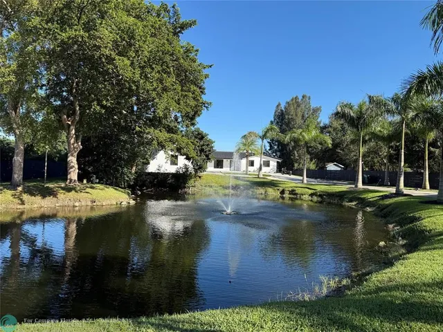 a view of a water fountain and an outdoor space
