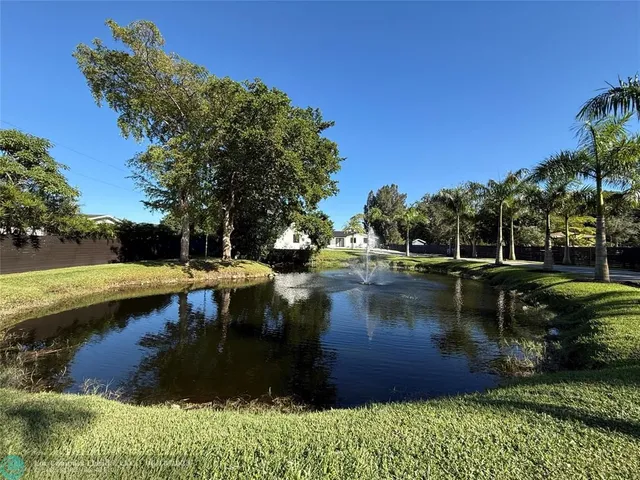 a view of swimming pool with yard and outdoor seating