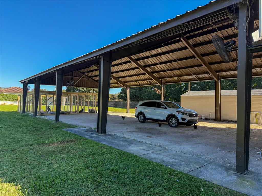 5790 Melaleuca Road Southwest Ranches, FL 33330 - Photo 38 of 44 a view of yard with car parked