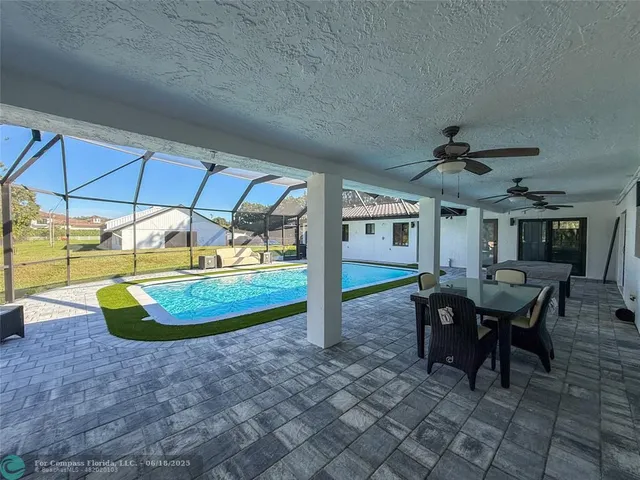 a view of a swimming pool with a lounge chairs
