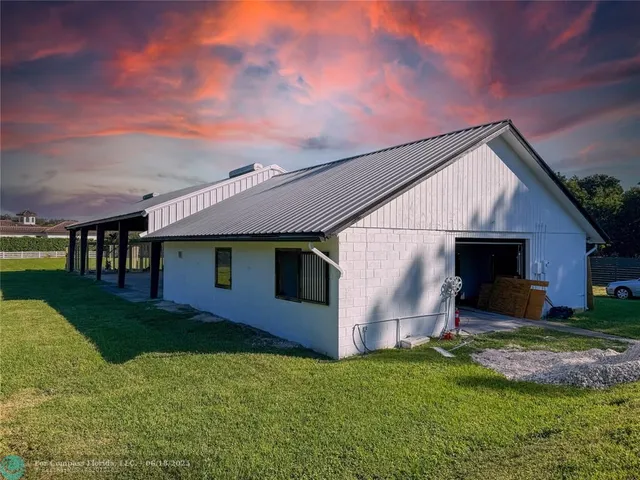 a backyard of a house with lots of green space