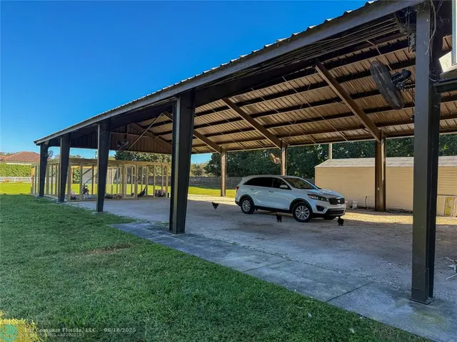 a view of backyard with garage