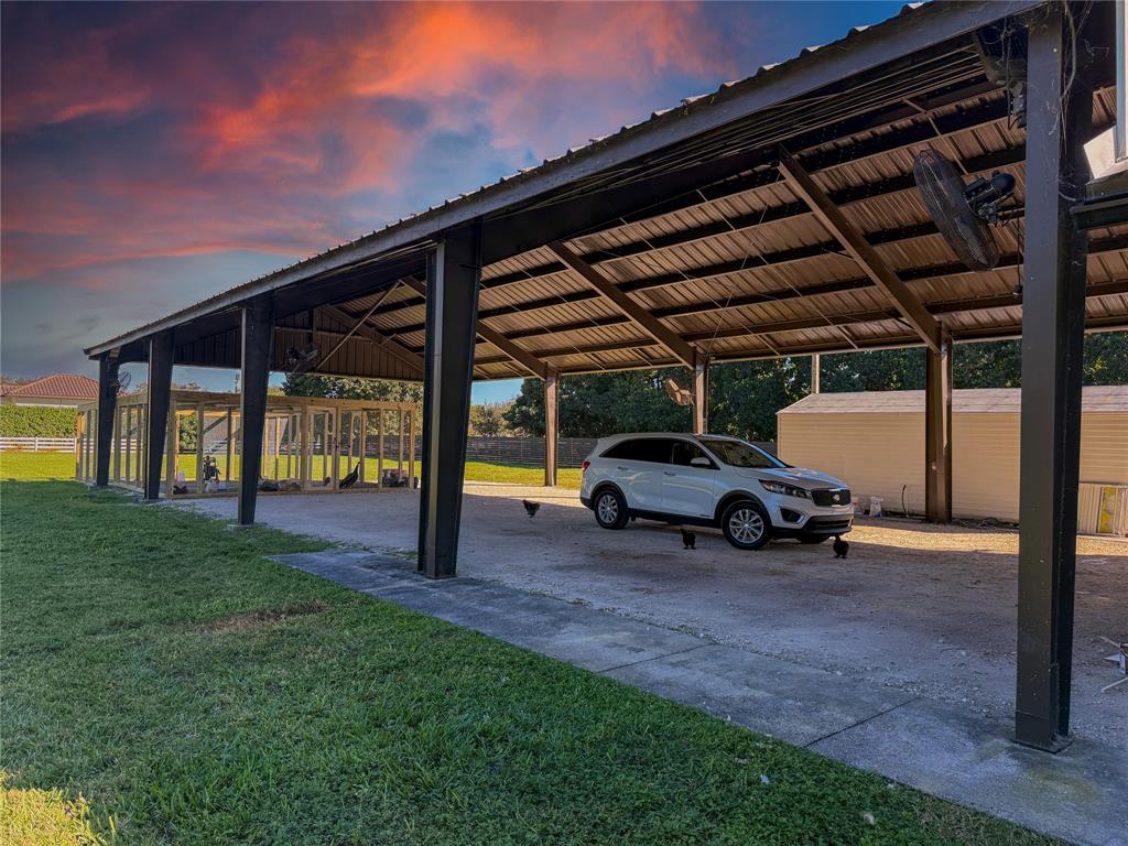 5790 Melaleuca Road Southwest Ranches, FL 33330 - Photo 5 of 44 a view of yard with car parked