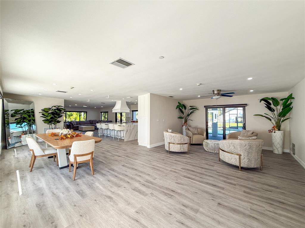 5790 Melaleuca Road Southwest Ranches, FL 33330 - Photo 7 of 44 a living room with furniture and a wooden floor
