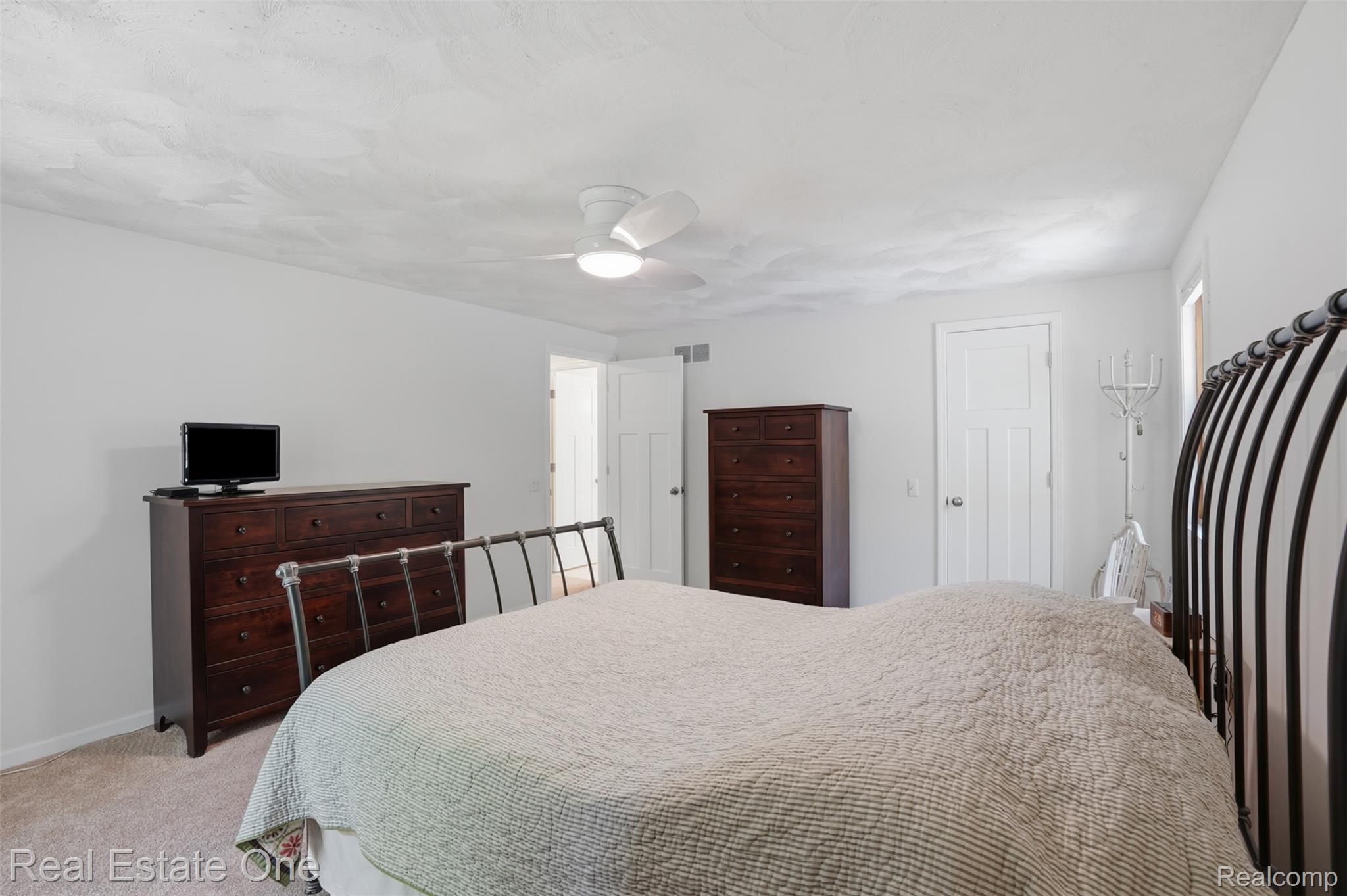 1765 Rowe Road Milford, MI 48380 - Photo 29 of 61 Carpeted room featuring light-colored walls and a textured ceiling