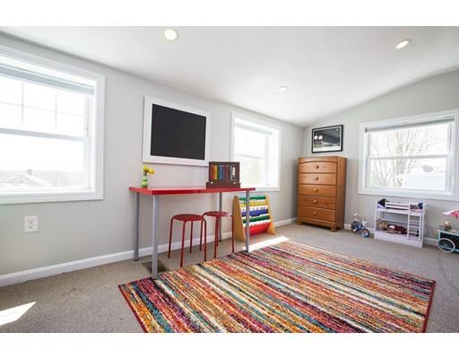26 Hallron Street Boston, MA 02136 - Photo 17 of 21 a room with furniture washing machine and a flat screen tv