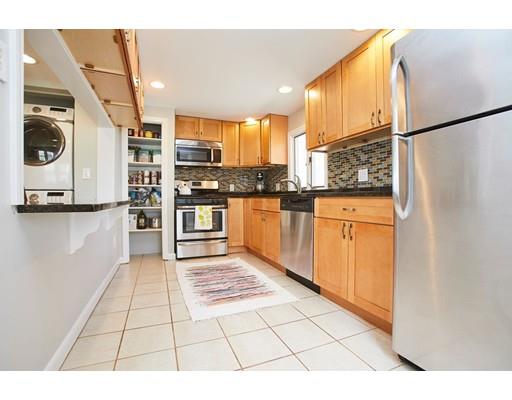 26 Hallron Street Boston, MA 02136 - Photo 10 of 21 a kitchen with stainless steel appliances granite countertop a refrigerator and a stove top oven