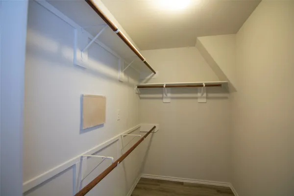 a view of an empty walk in closet