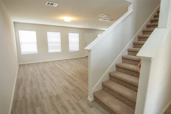 a view of entryway with wooden floor
