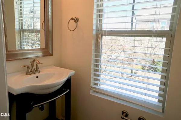 a bathroom with a sink and a window