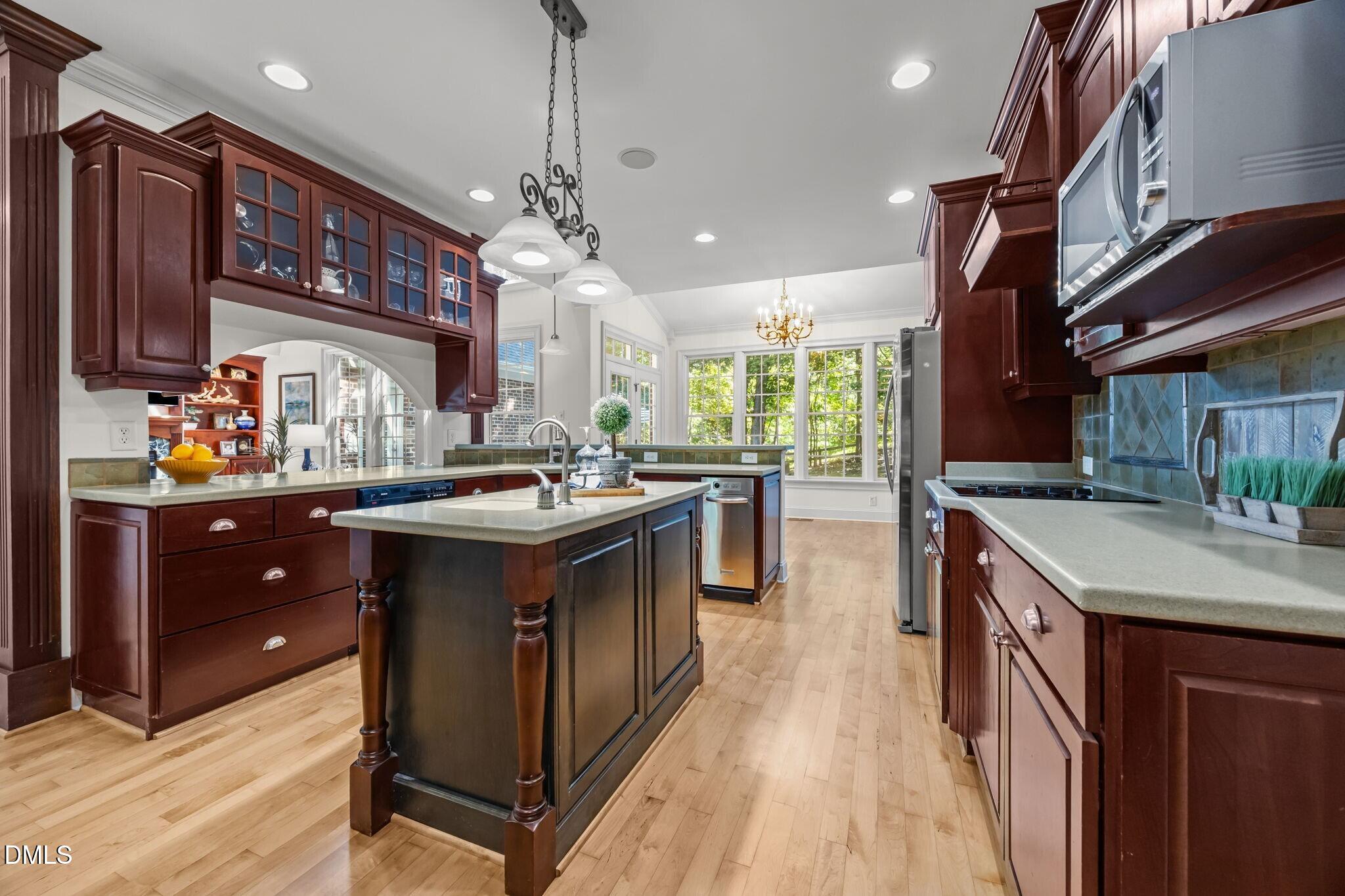 3901 Orchard Point Court Apex, NC 27539 - Photo 18 of 53 a kitchen with a stove and a sink