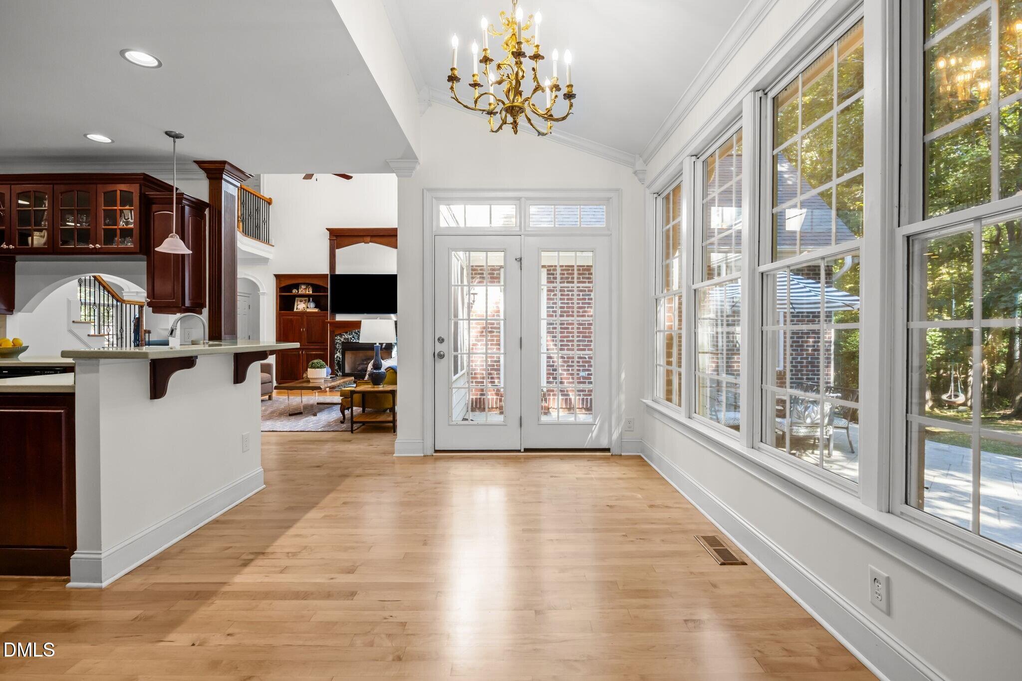 3901 Orchard Point Court Apex, NC 27539 - Photo 22 of 53 a view of an entryway with wooden floor and windows