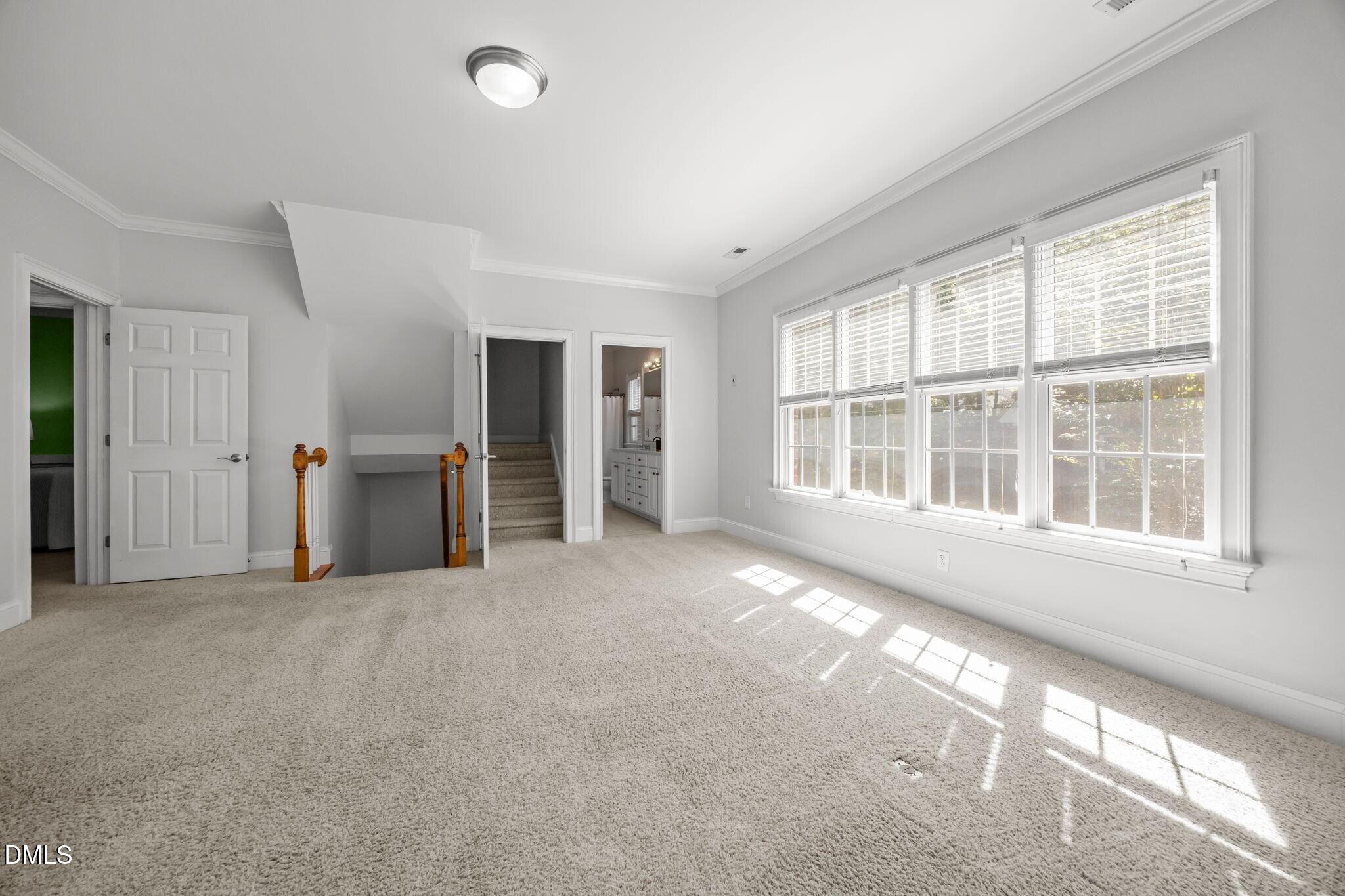3901 Orchard Point Court Apex, NC 27539 - Photo 26 of 53 a view of an empty room with a window and kitchen