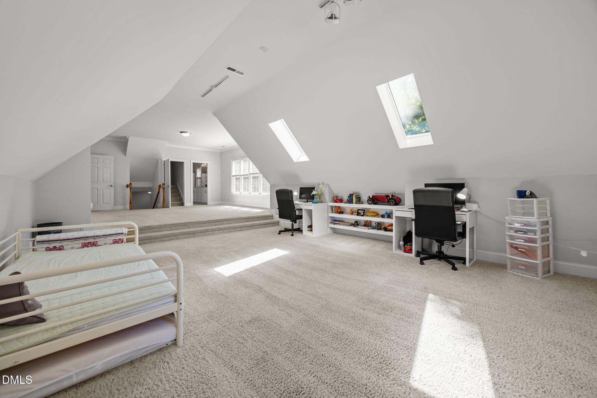 3901 Orchard Point Court Apex, NC 27539 - Photo 27 of 53 a living room with furniture and a wooden floor