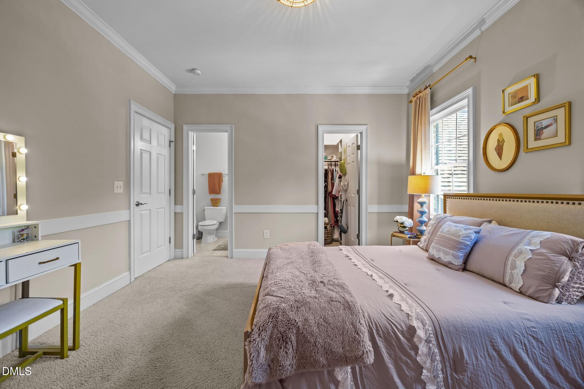 3901 Orchard Point Court Apex, NC 27539 - Photo 33 of 53 a bedroom with a bed and a cabinets