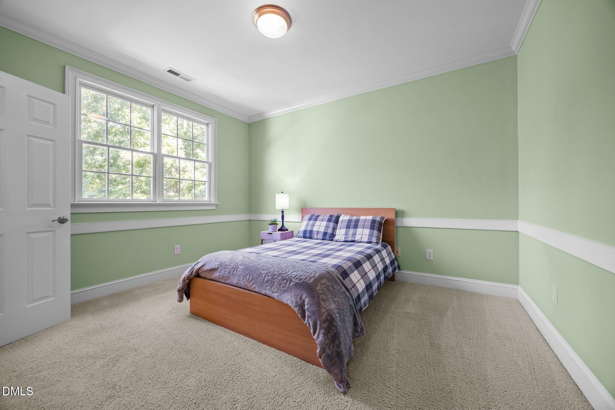 3901 Orchard Point Court Apex, NC 27539 - Photo 34 of 53 a bedroom with a bed and a window