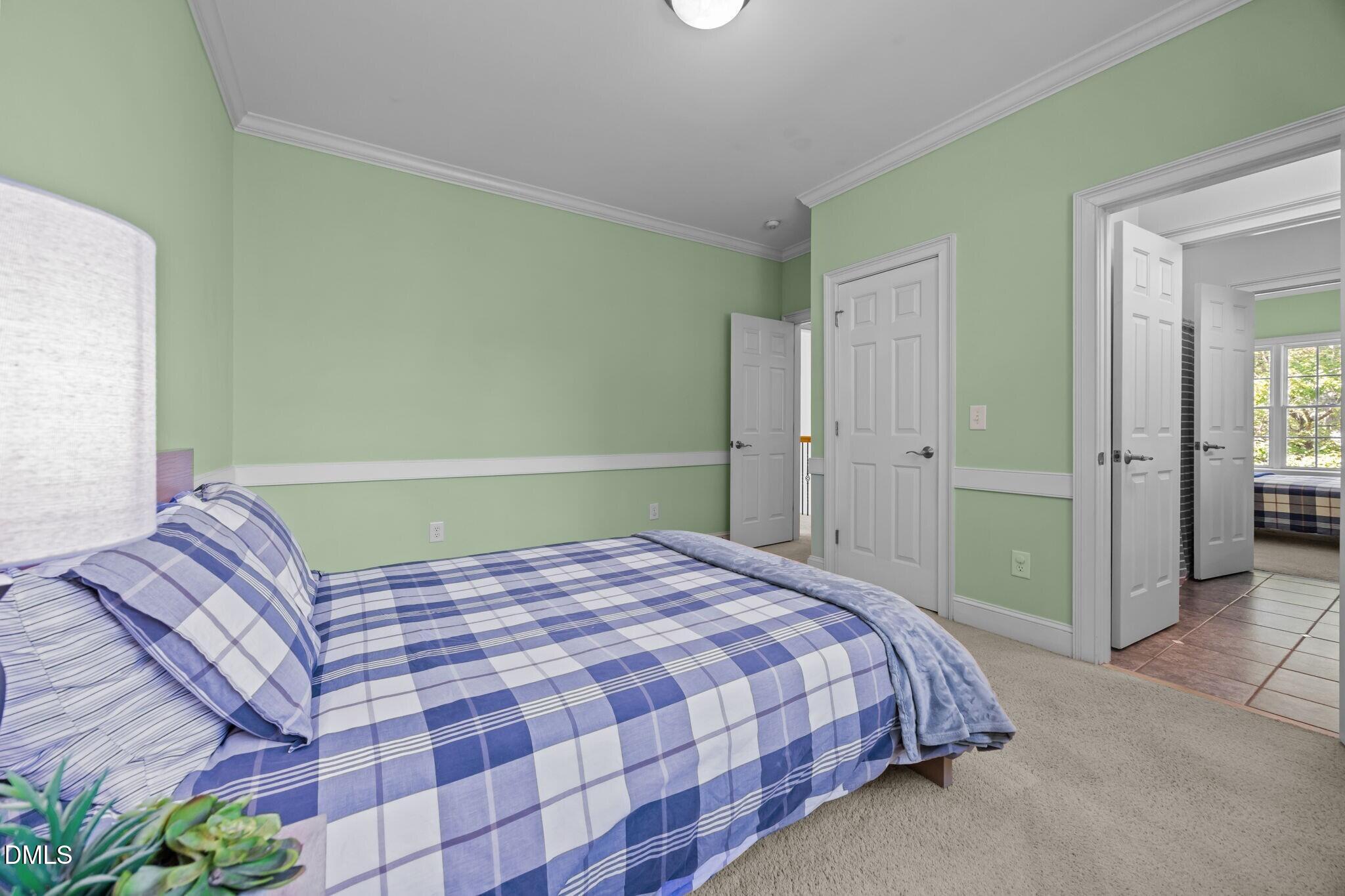 3901 Orchard Point Court Apex, NC 27539 - Photo 35 of 53 a bedroom with a bed and a shower